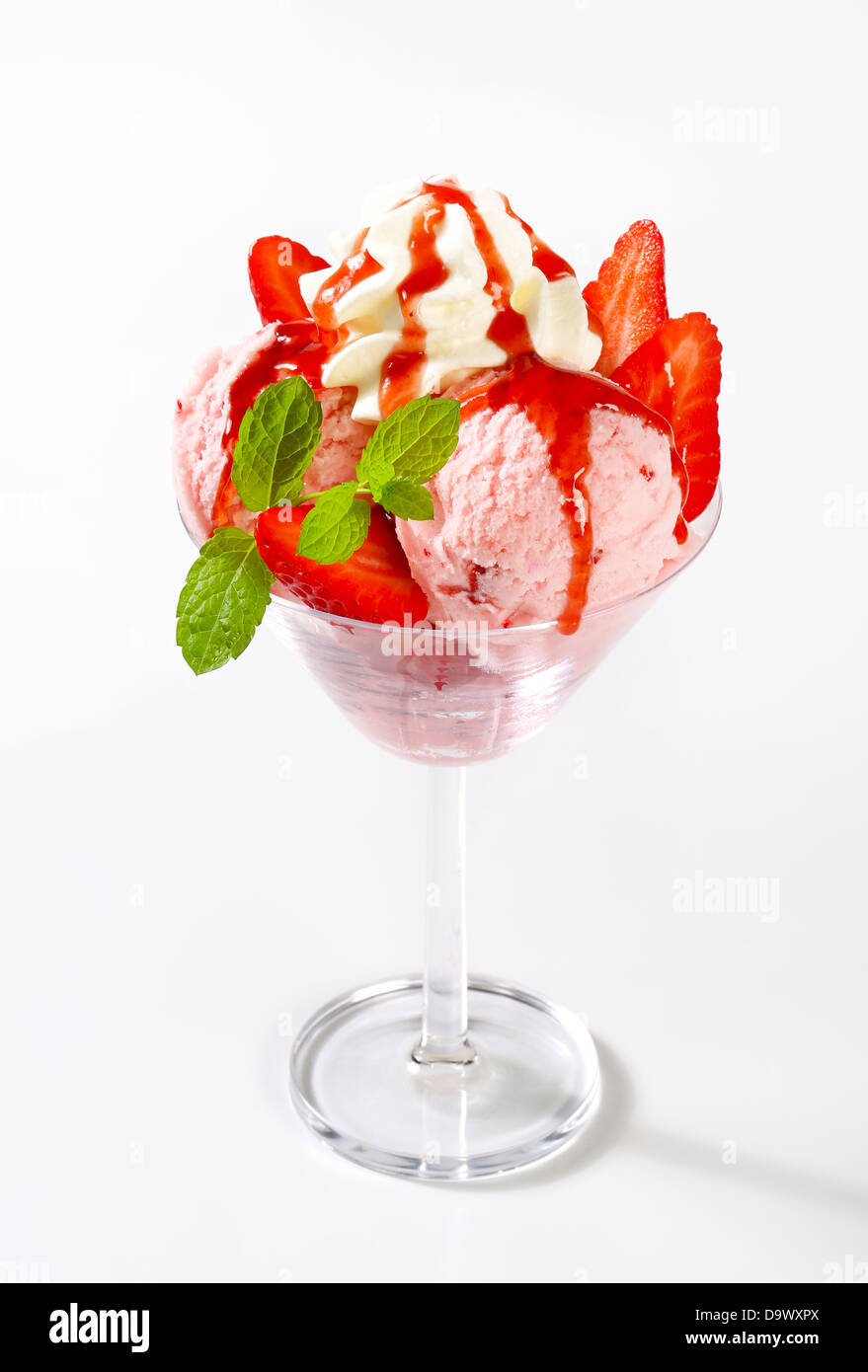 Ice cream with fresh strawberries and whipped cream Stock Photo