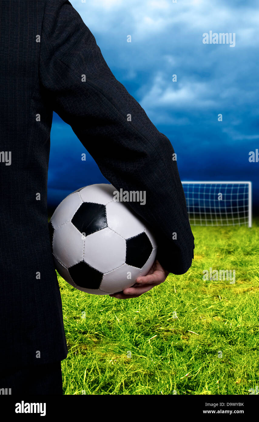businessman in suit with a soccer ball Stock Photo - Alamy