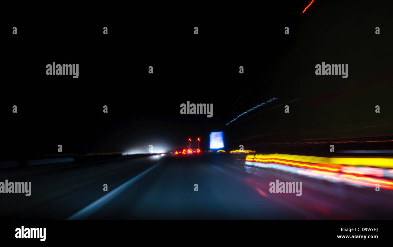 Fast moving and light trails of trucks and cars on a highway Stock Photo