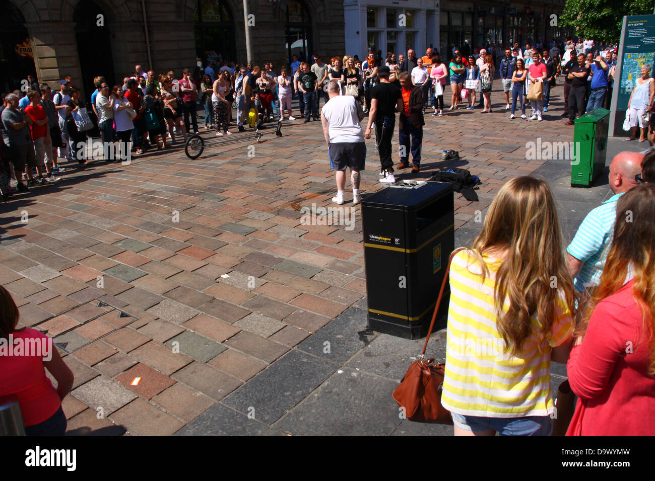 Crowds watching street performers Buchanan Street Glasgow summer Stock Photo
