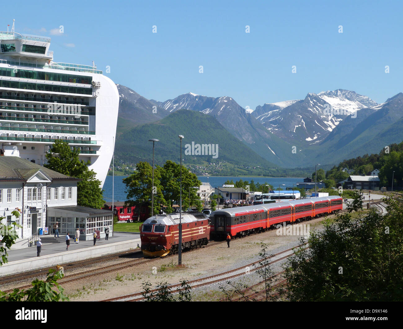 The P&O cruise ship Ventura at Berth in Andalsnes, Norwegian Fjords. Rauma railway train in the station. Stock Photo