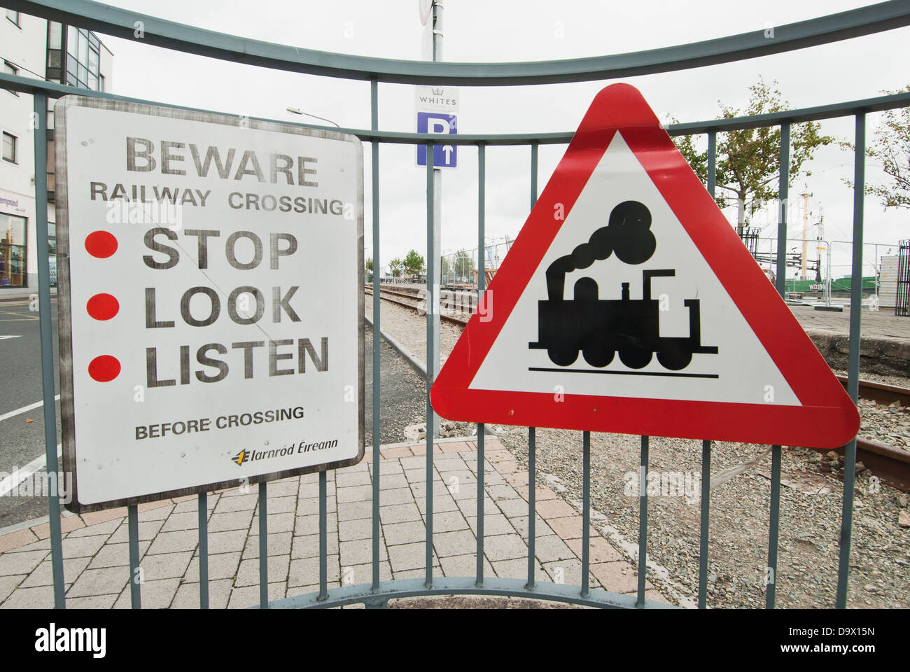 Signs Posted On A Fence Warning Of A Railway Crossing Ireland Stock Photo Alamy