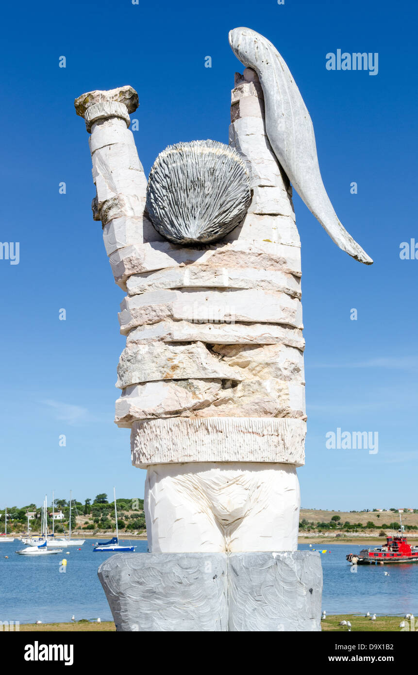 Stone statue of man holding fish in the Portuguese fishing town of