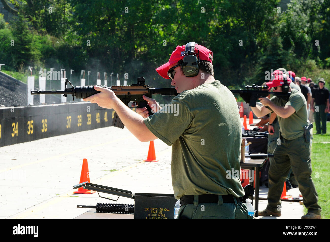 FBI Agents practice shooting automatic rifles or AR's at FBI practice