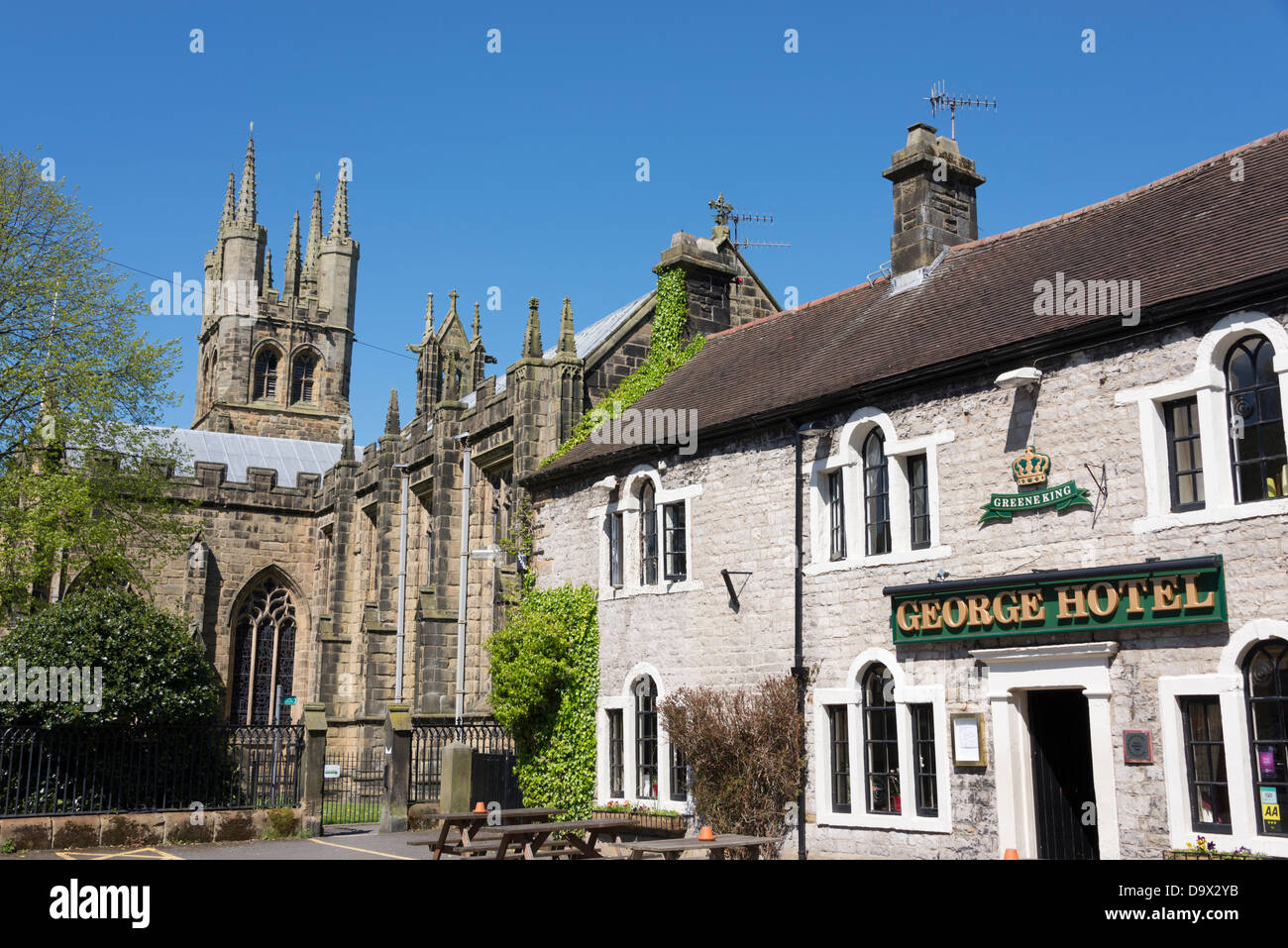 The George Hotel and St John the Baptist church Tideswell, Derbyshire, England. Stock Photo