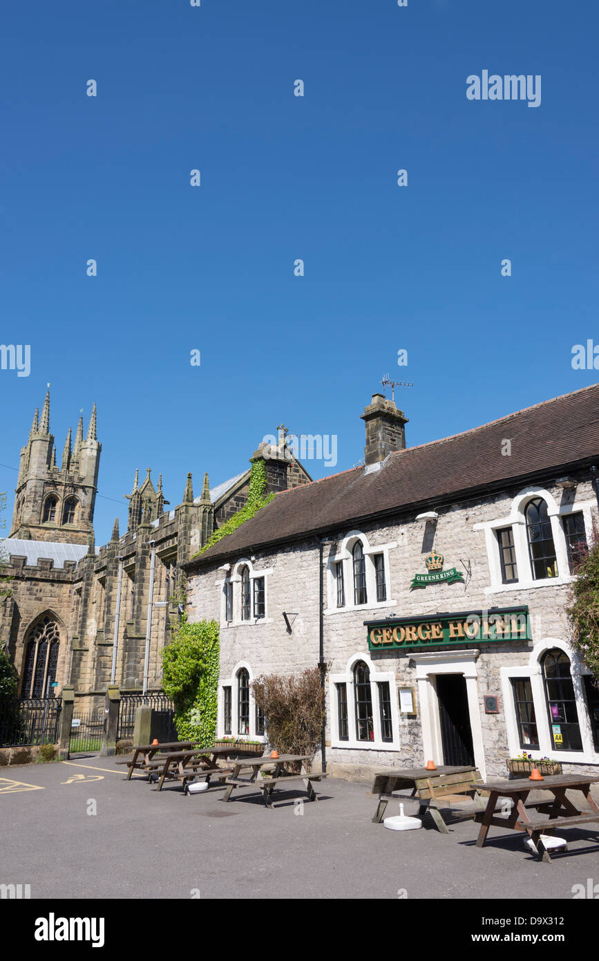 The George Hotel and St John the Baptist church Tideswell, Derbyshire, England. Stock Photo