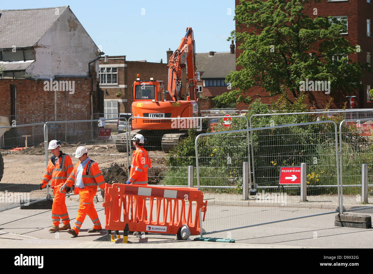 contractors using an excavator Stock Photo Alamy