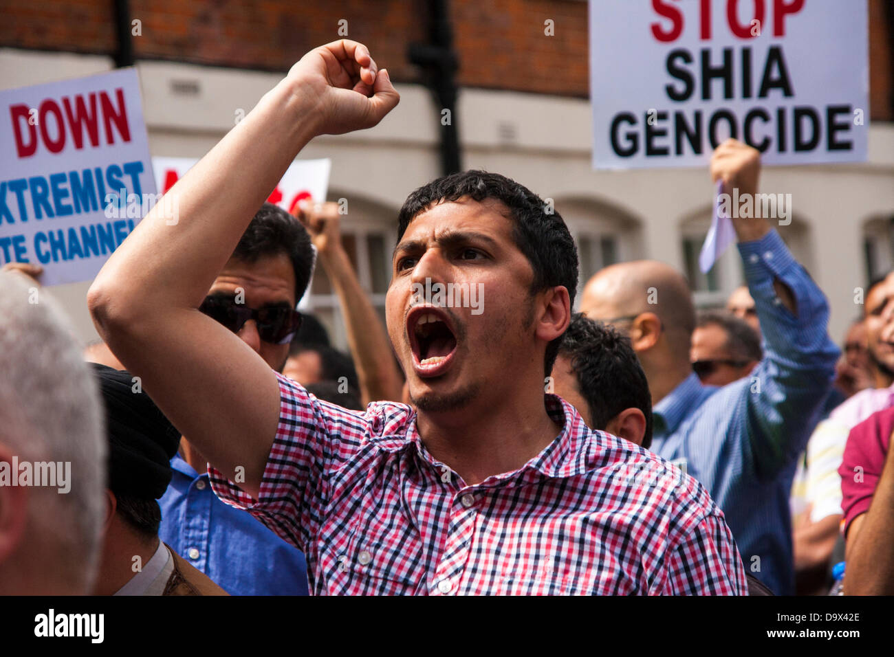 London, UK. 27th June 2013. A demonstrator yells slogans as Egyptians in London protest against sectarian killings in Egypt. Credit:  Paul Davey/Alamy Live News Stock Photo