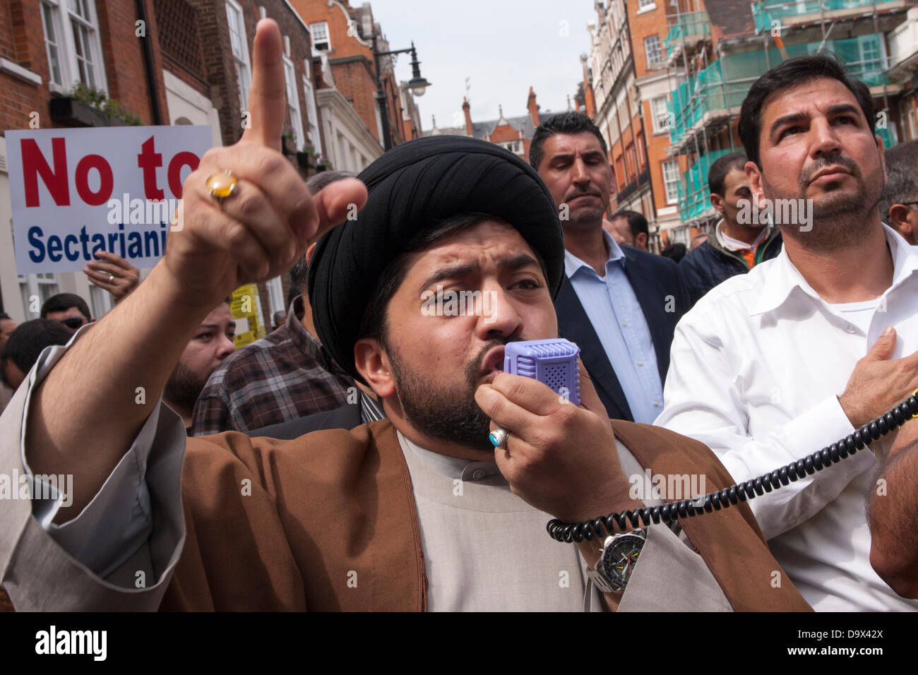 London, UK. 27th June 2013. A Muslim cleric addresses the crowd as Egyptians in London protest against sectarian killings in Egypt. Credit:  Paul Davey/Alamy Live News Stock Photo