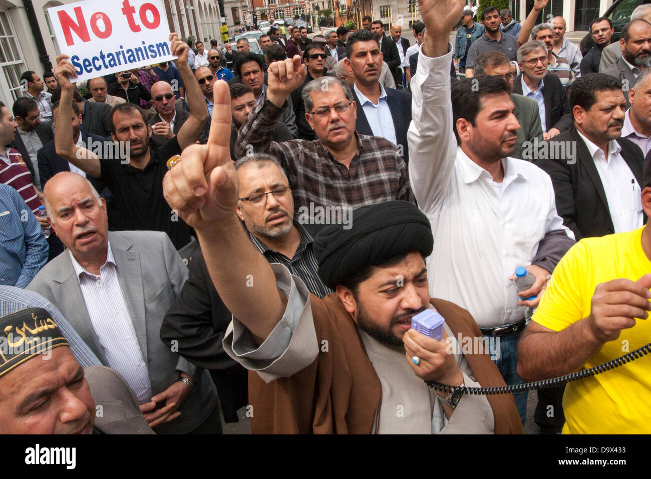 London, UK. 27th June 2013. A Muslim cleric addresses the crowd as Egyptians in London protest against sectarian killings in Egypt. Credit:  Paul Davey/Alamy Live News Stock Photo