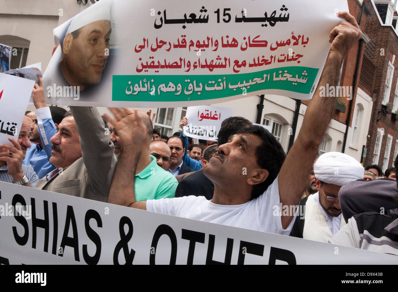 London, UK. 27th June 2013. A demonstrator displays his banner as Egyptians in London protest against sectarian killings in Egypt. Credit:  Paul Davey/Alamy Live News Stock Photo