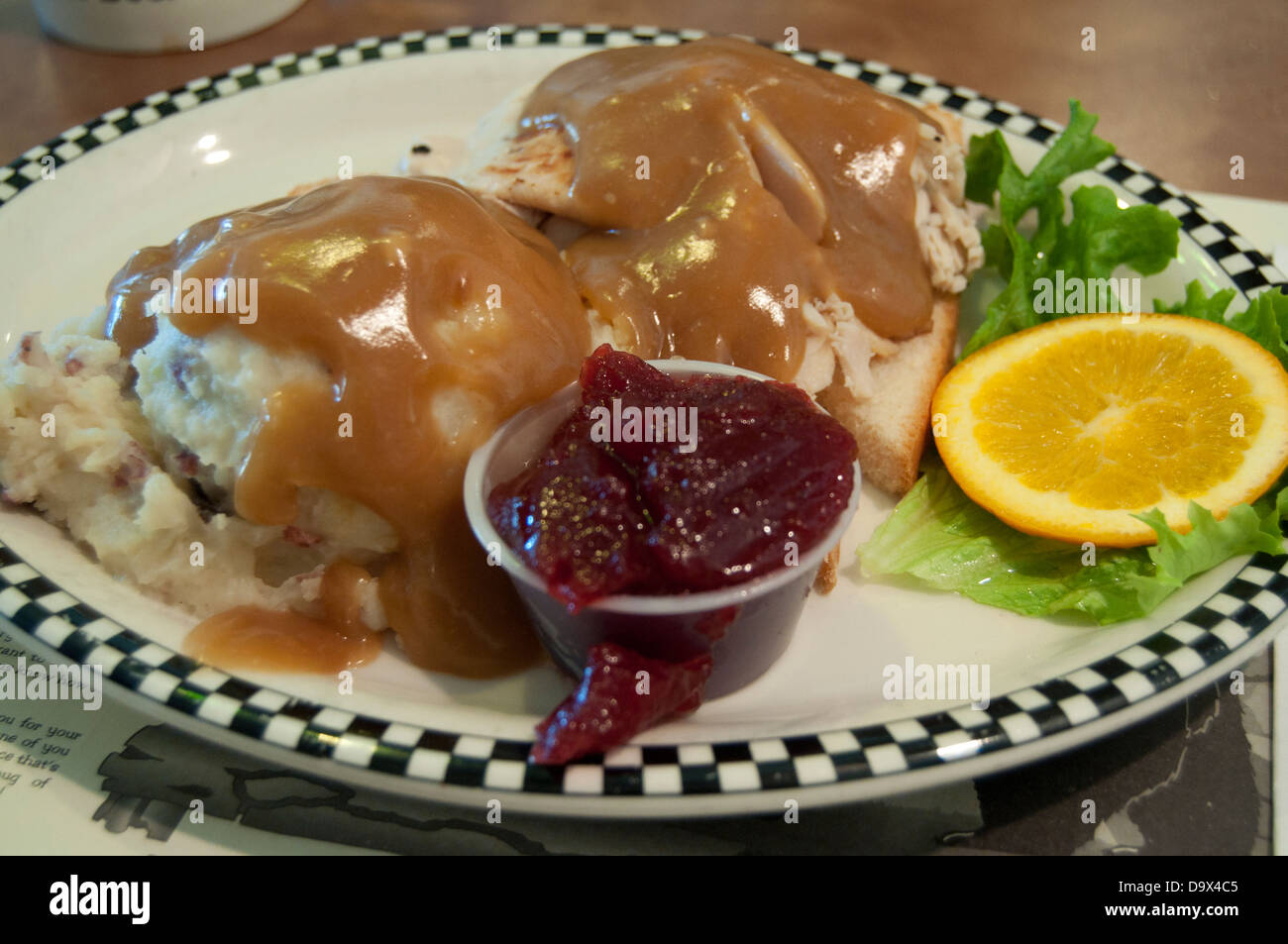 Hot turkey sandwich with mashed potatoes,gravy and cranberry sauce