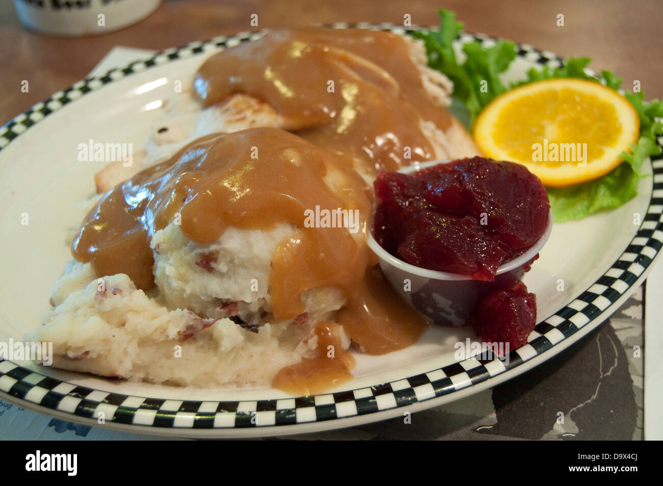 Hot turkey sandwich with mashed potatoes,gravy and cranberry sauce