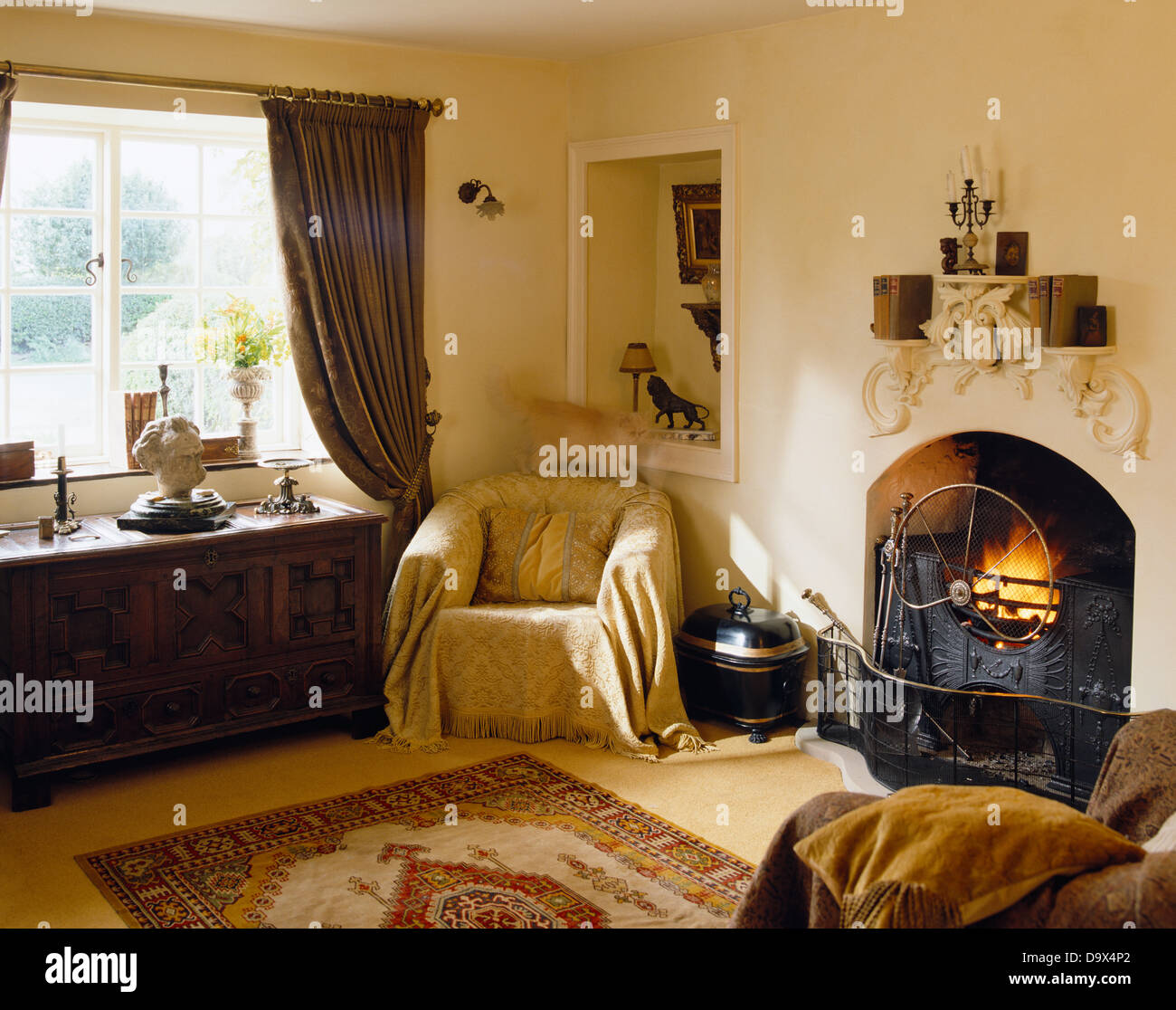 Cream Throw On Chair In Corner Of Room Next To Fireplace And