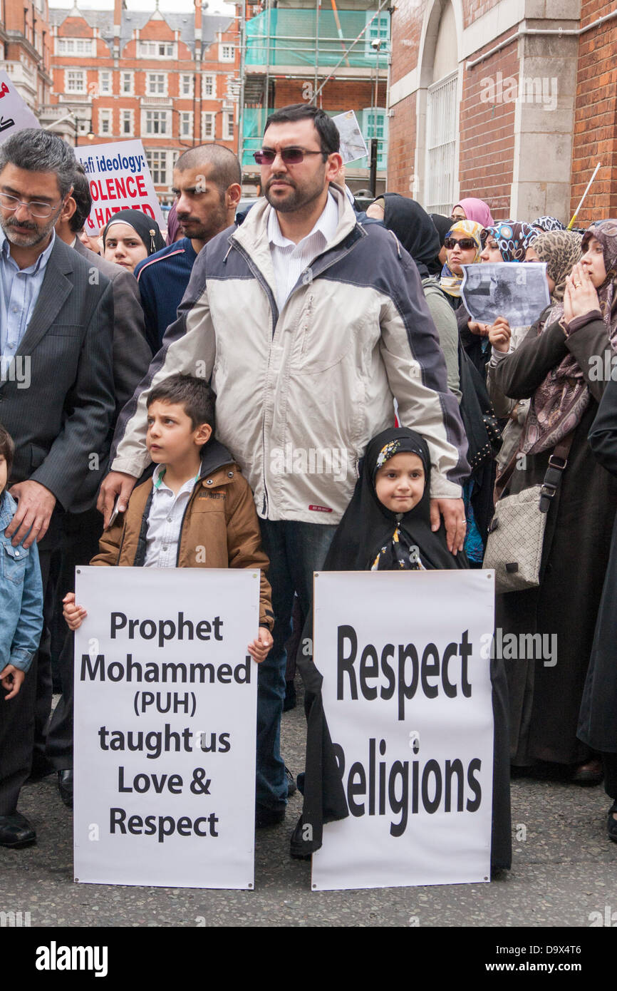 London, UK. 27th June 2013. Children remind Muslims about the true meaning of Islam as Egyptians in London protest against sectarian killings in Egypt. Credit:  Paul Davey/Alamy Live News Stock Photo
