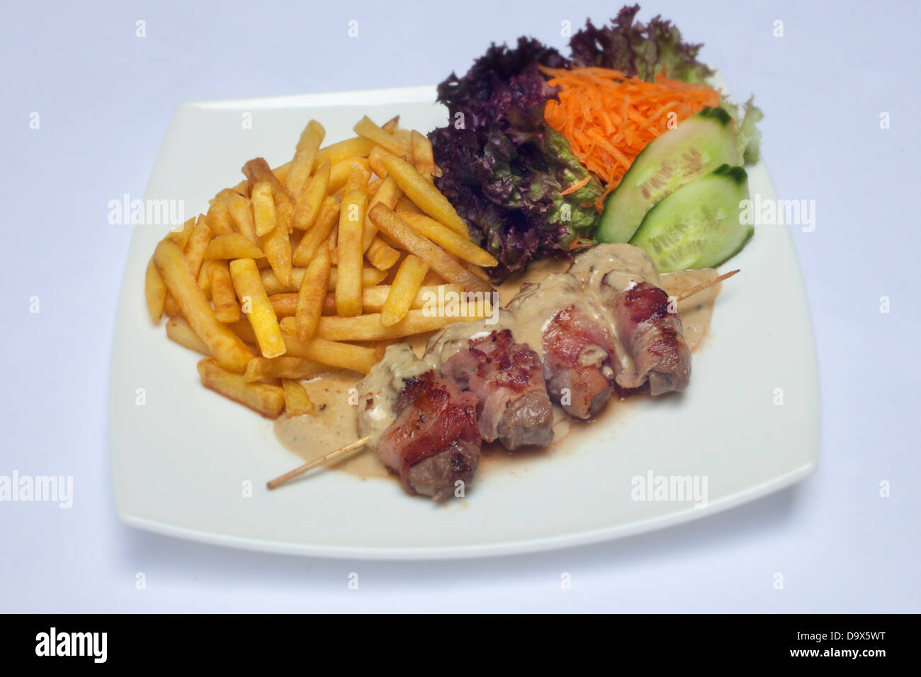 meat and chips and vegetables Stock Photo