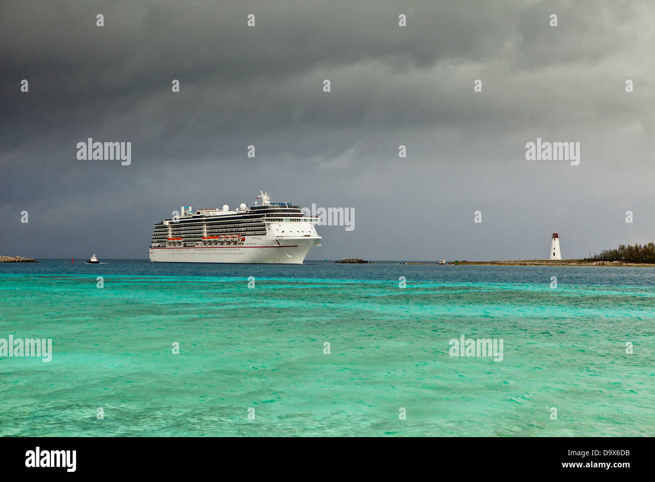 cruise ship entering port during storm in bahamas Stock Photo