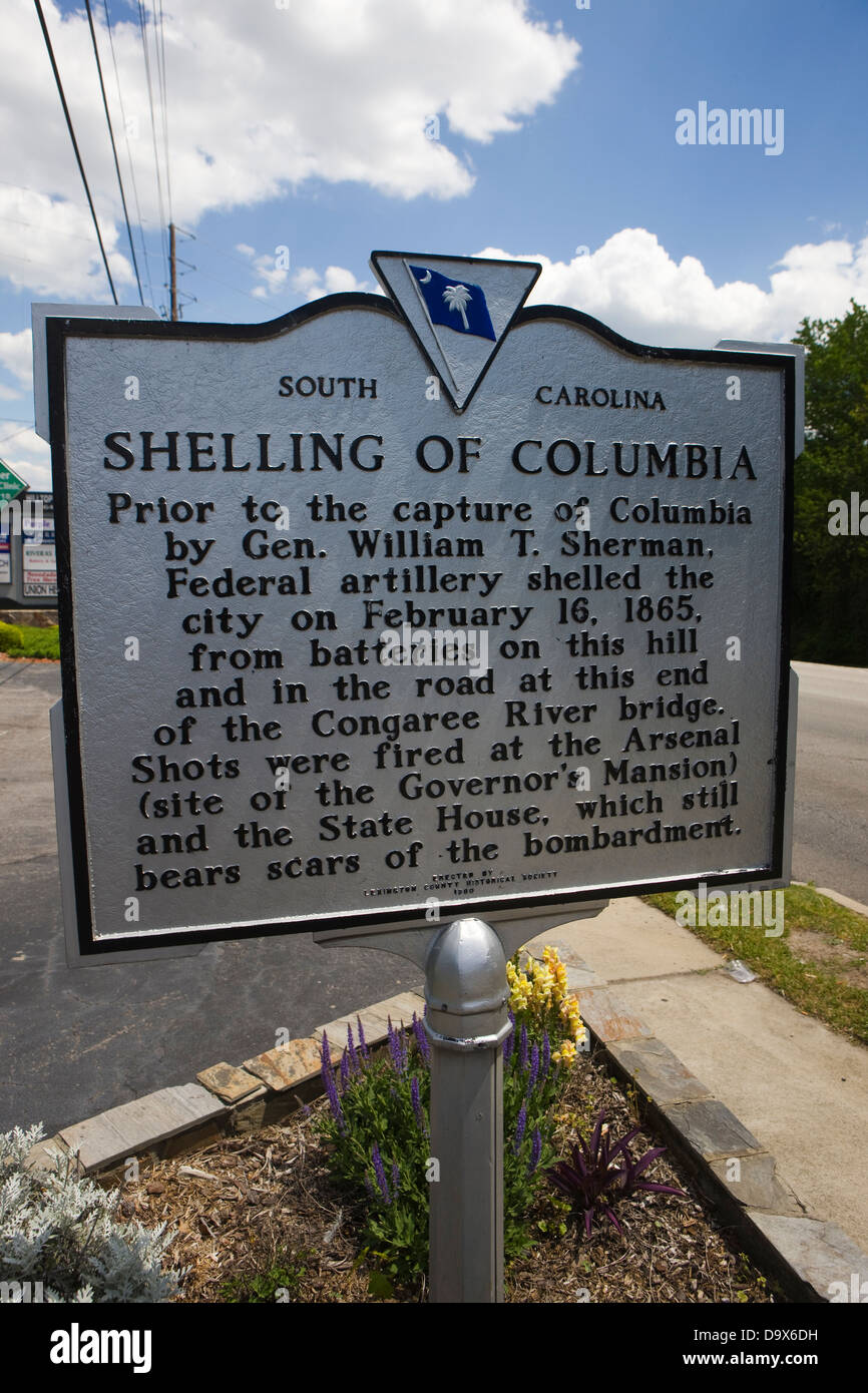 SHELLING OF COLUMBIA Prior to the capture of Columbia by Gen. William T. Sherman, Federal artillery shelled the city on February 16, 1865, from the batteries on this hill and in the road at this end of the Congaree River bridge. Shots were fired at the Arsenal (site of the Governor's Mansion) and the State House, which still bears scars of the bombardment. Erected by Lexington County Historical Society, 1964 Stock Photo