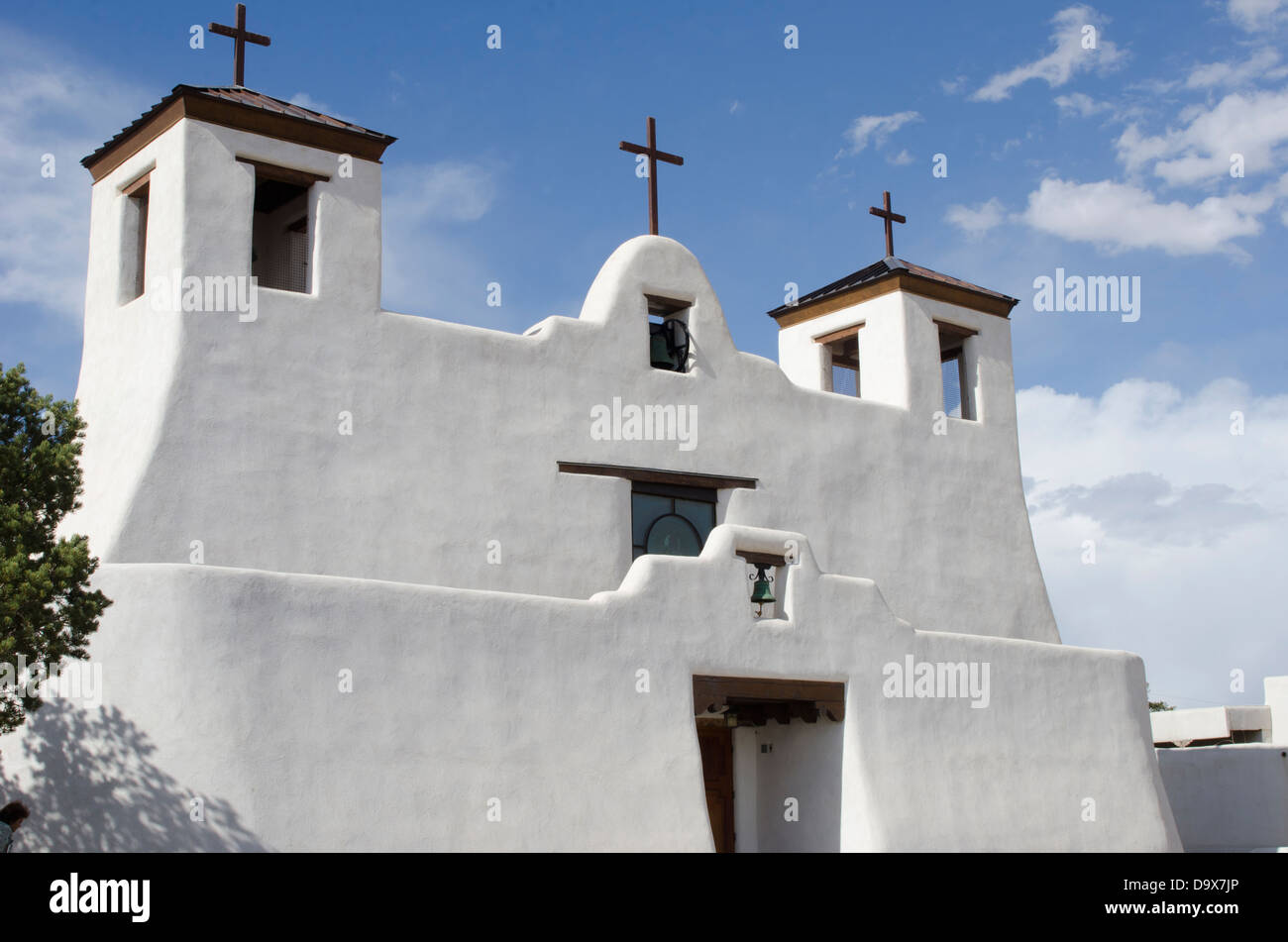 The graceful stucco lines of the St. Agustin Mission Church in the Pueblo of Isleta is reminiscent of the old Taos Church. Stock Photo