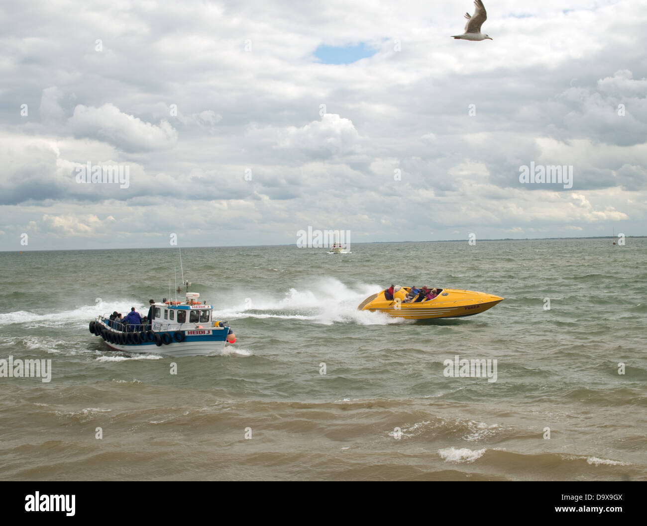 Bridlingtons speed boat passing a fishing boat returning to harbour on