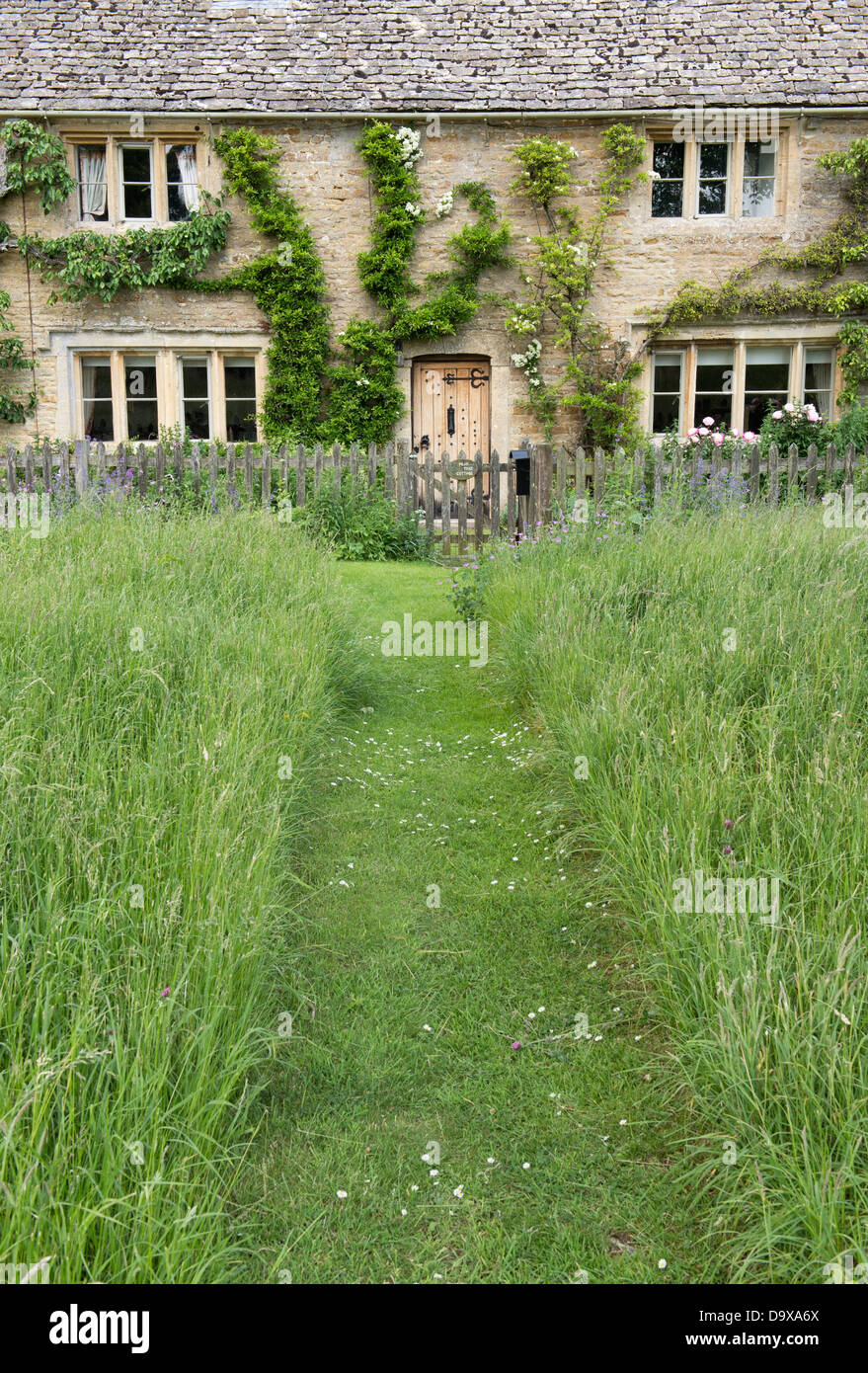 Mown Path Through Long Grass Leading Upto Cotswold Stone Cottage