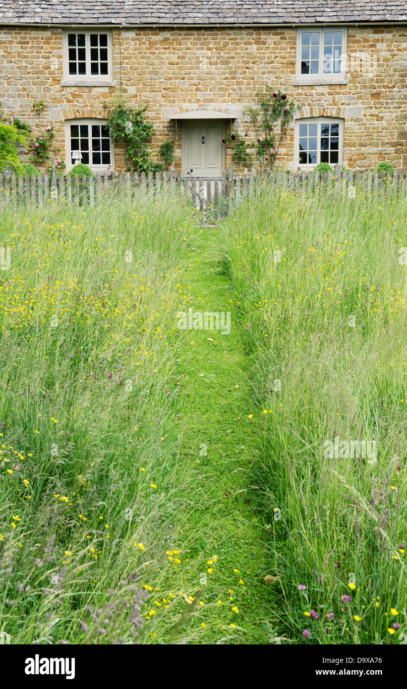 Mown Path Through Long Grass Leading Upto Cotswold Stone Cottage