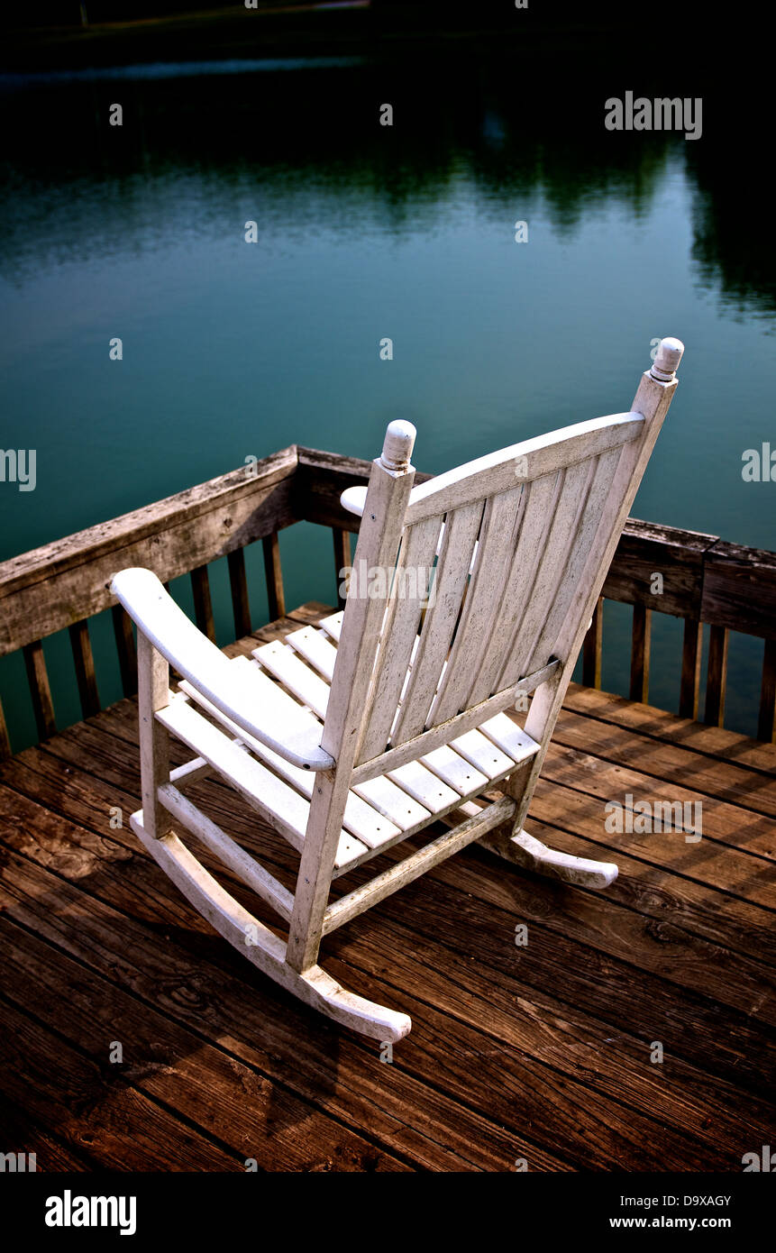 Rocking chair by a lake in South Carolina, USA Stock Photo