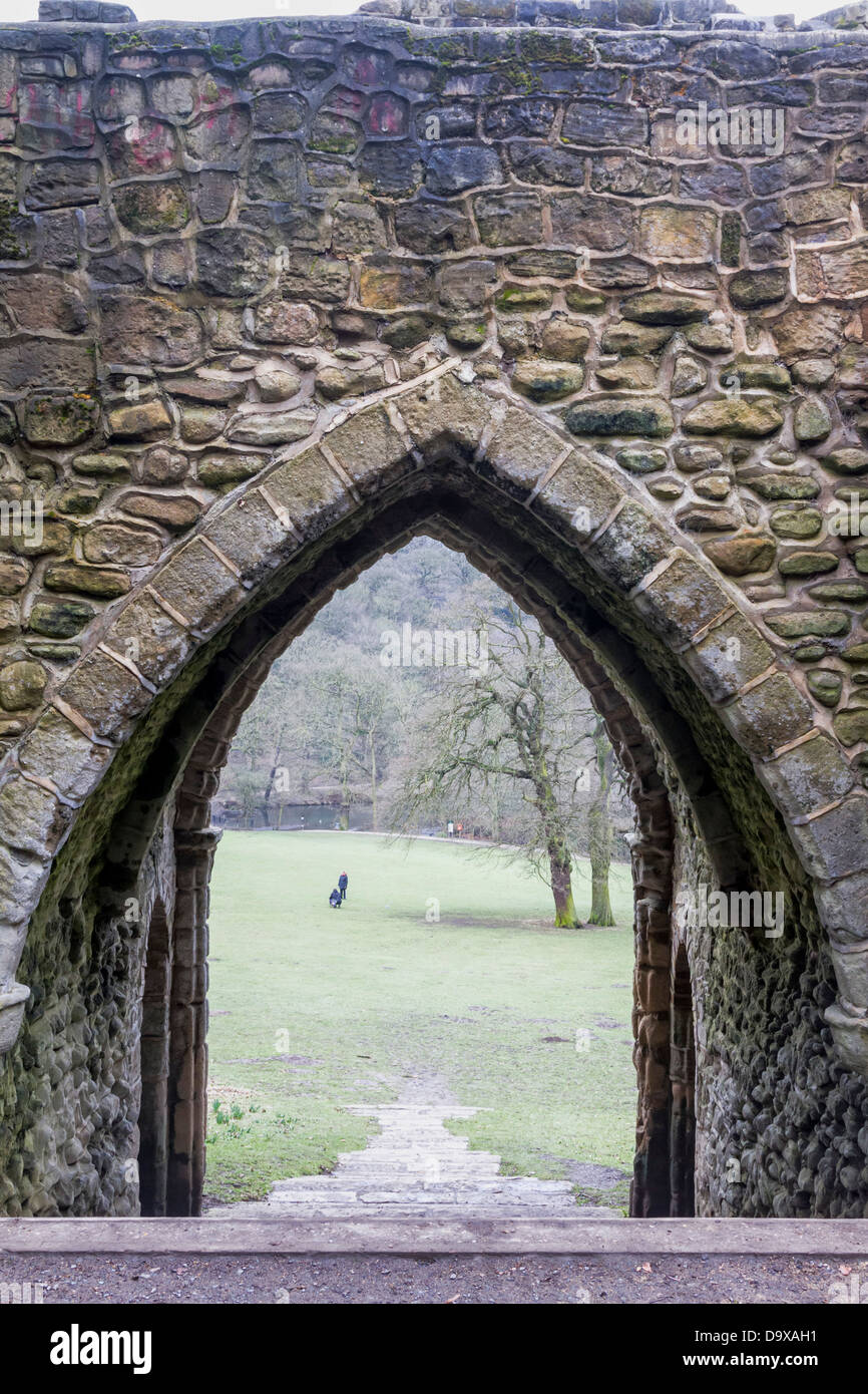 Central arch in the folly in Roundhay Park looking down the hill towards the lower lake Stock Photo