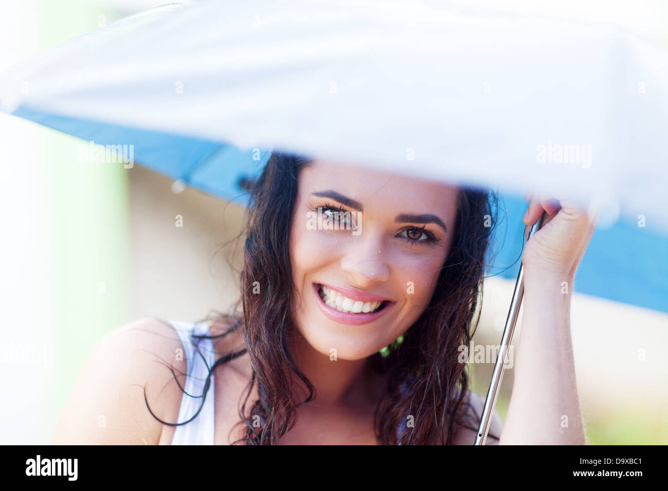 pretty young woman under umbrella in the rain Stock Photo
