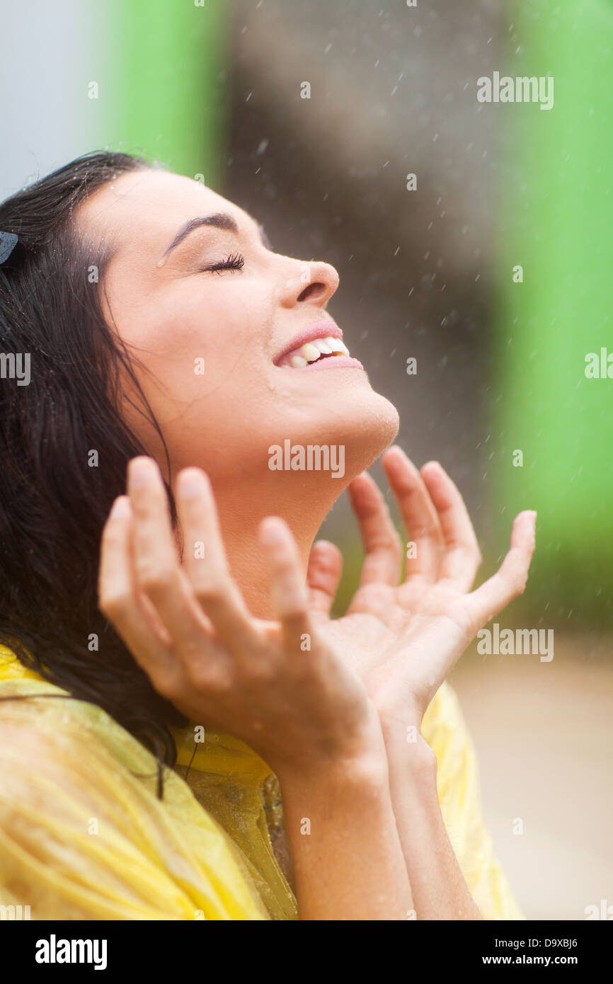 happy young woman having fun in the rain Stock Photo