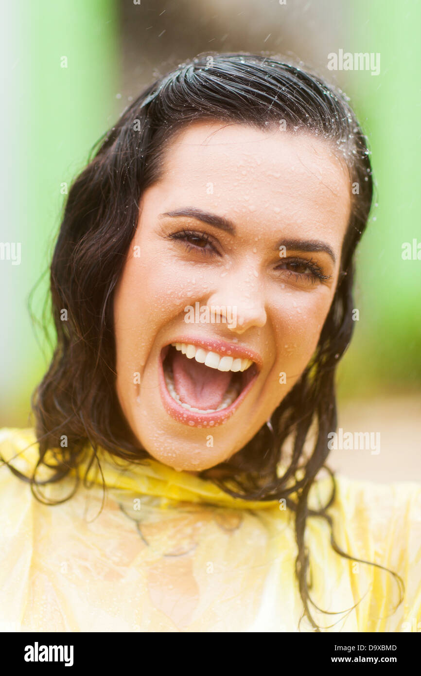 happy woman face closeup in the rain Stock Photo
