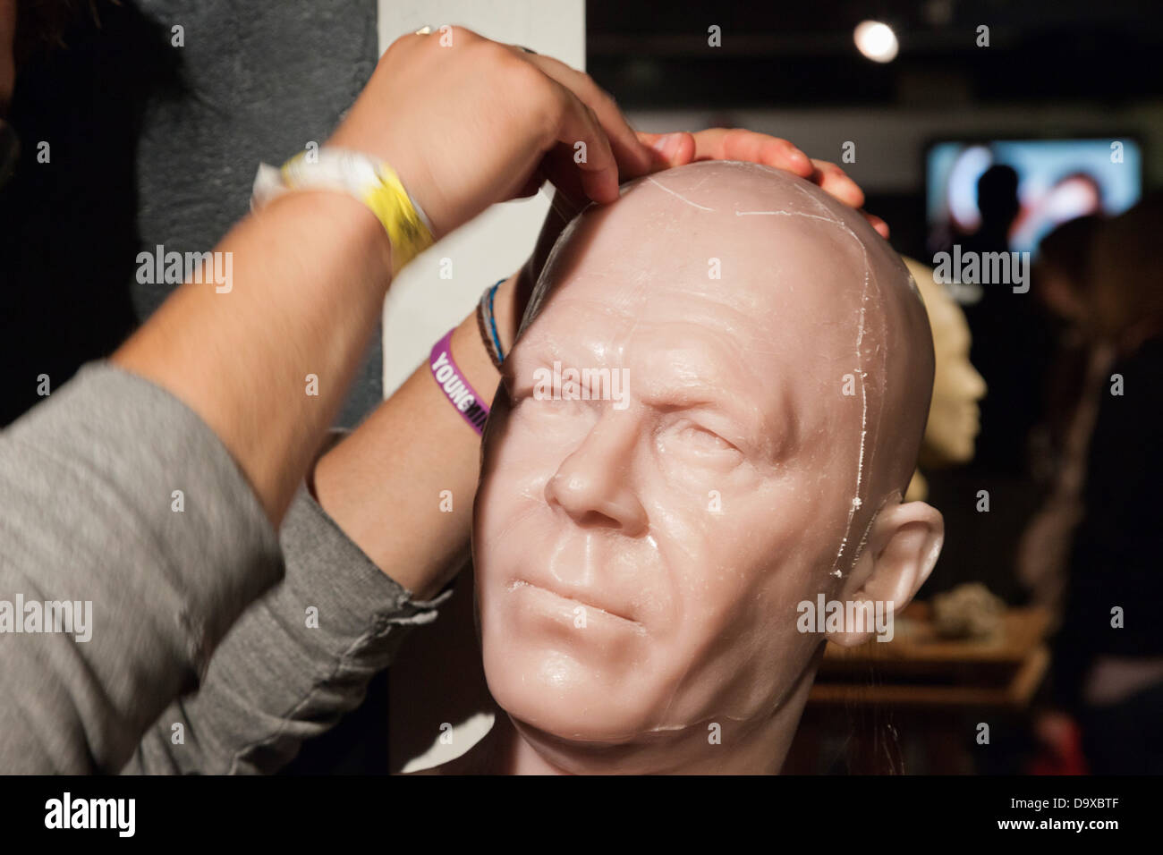 UK, England, London, Madame Tussauds, Demonstration of Implanting Hair into Waxwork Head Stock Photo