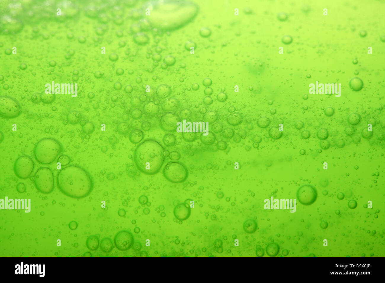 Green abstract blurred liquid background with soap bubbles Stock Photo ...