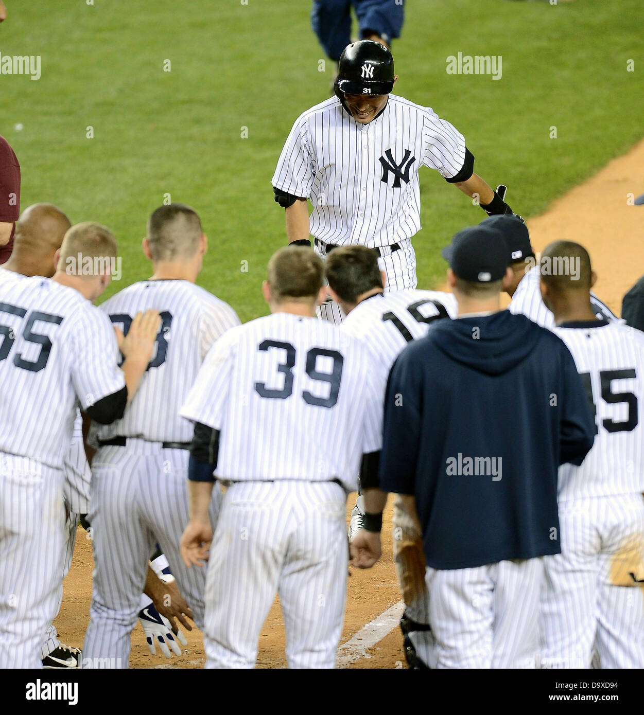 Ichiro Suzuki (Yankees), JUNE 25, 2013 - MLB : Ichiro Suzuki of the New York Yankees is greeted by his teammates at home plate after hitting a walk off home run in the ninth inning during the Major League Baseball game against the Texas Rangers at Yankee Stadium in The Bronx, New York, United States. (Photo by AFLO) Stock Photo