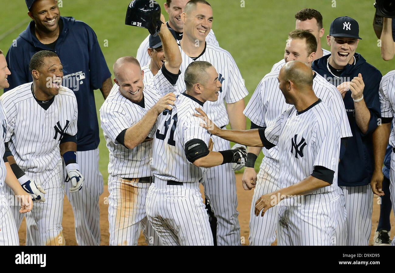 Ichiro Suzuki (Yankees), JUNE 25, 2013 - MLB : Ichiro Suzuki of the New York Yankees celebrates with his teammates at home plate after hitting a walk off home run in the ninth inning during the Major League Baseball game against the Texas Rangers at Yankee Stadium in The Bronx, New York, United States. (Photo by AFLO) Stock Photo