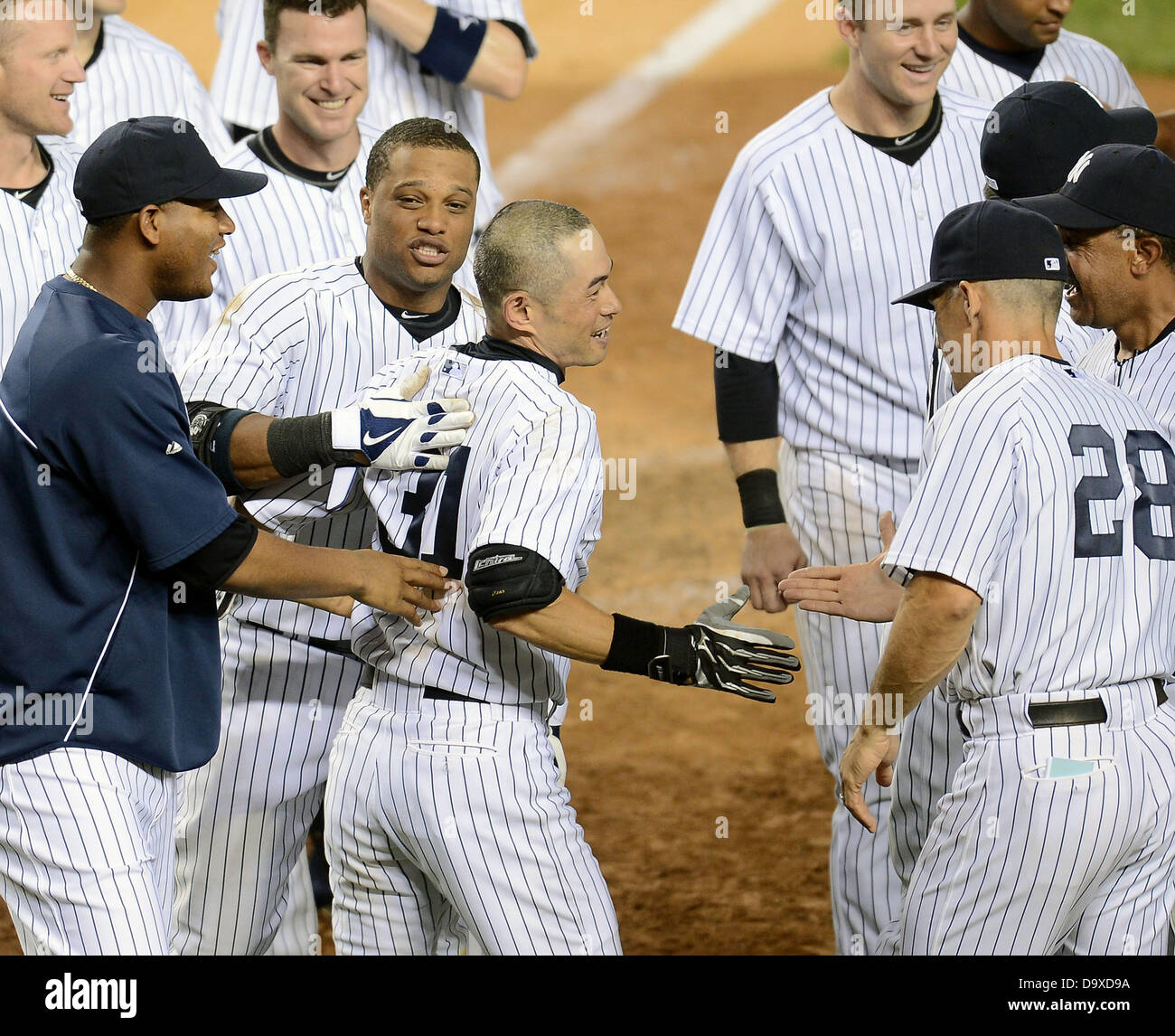 Ichiro Suzuki (Yankees), JUNE 25, 2013 - MLB : Ichiro Suzuki of the New York Yankees celebrates with his teammates at home plate after hitting a walk off home run in the ninth inning during the Major League Baseball game against the Texas Rangers at Yankee Stadium in The Bronx, New York, United States. (Photo by AFLO) Stock Photo