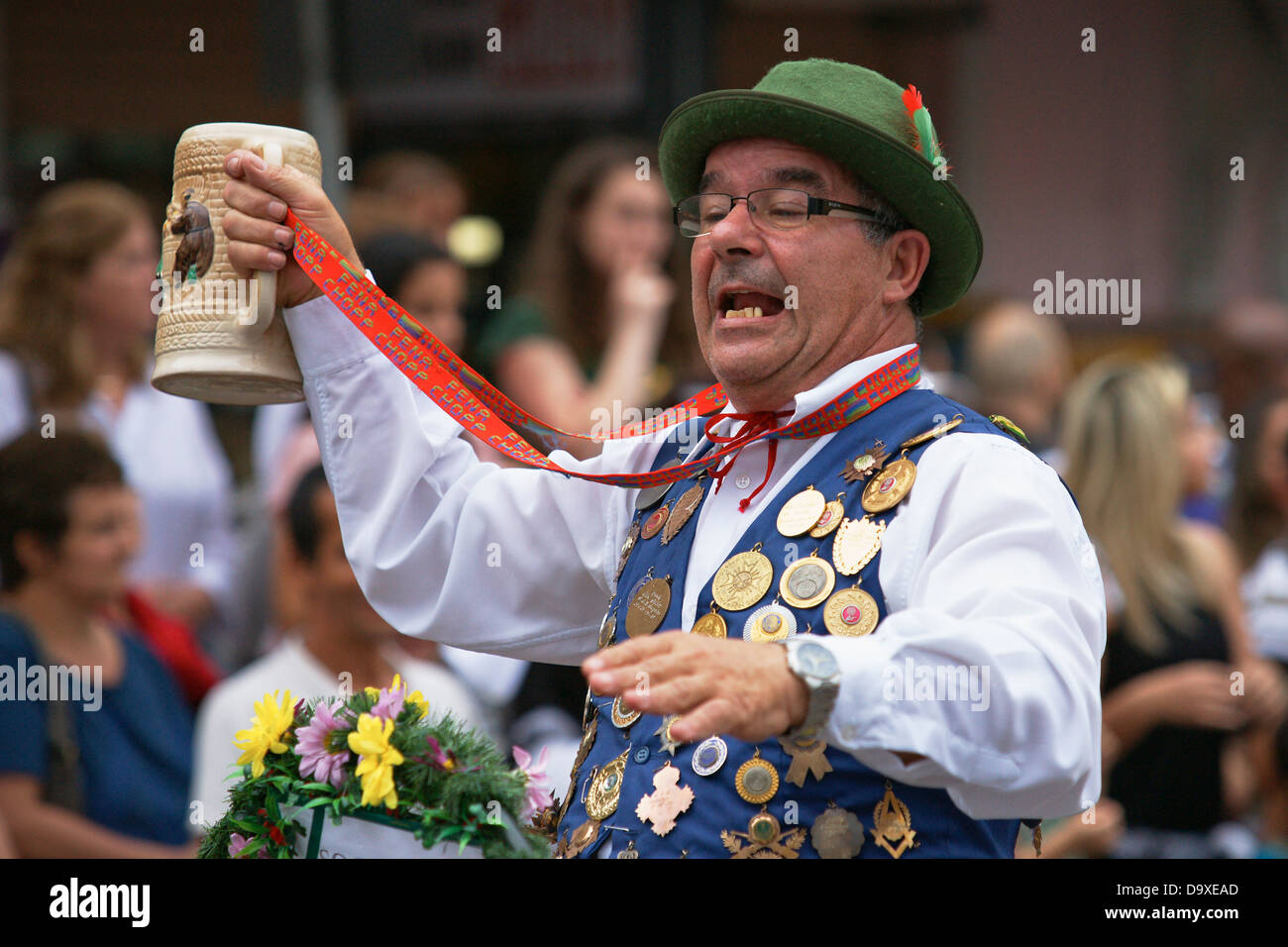 Elder bavarian style dressed member of a gun shooting club wearing his medal vest having a good time Stock Photo