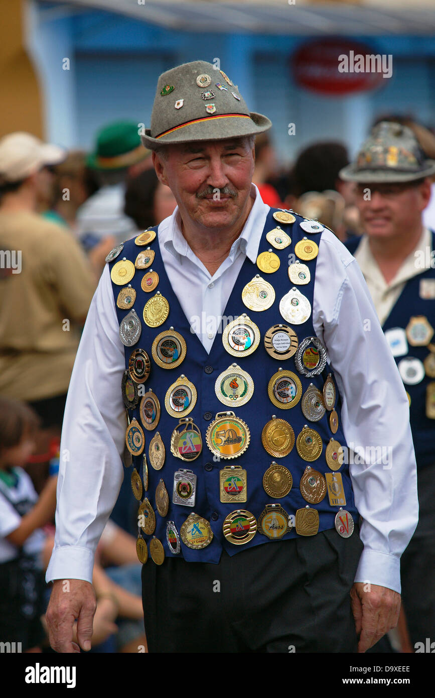 Medal vest wearing gun shooting club member during the Oktoberfest parade Stock Photo