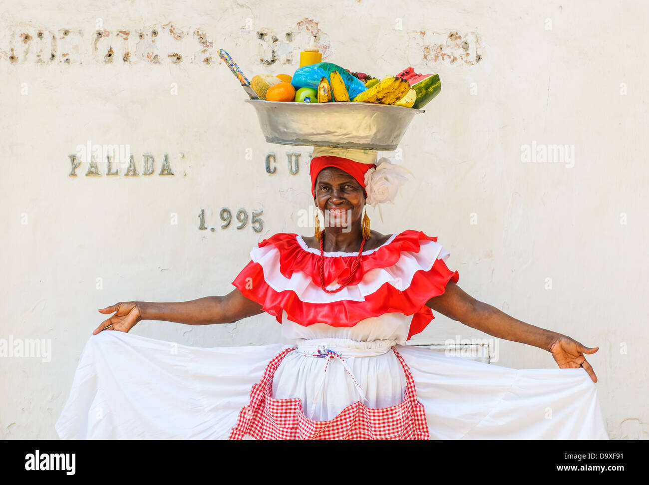 Palenquera woman sells fruits at Plaza Santo Domingo on December, 02, 2009 in Cartagena, Colombia Stock Photo