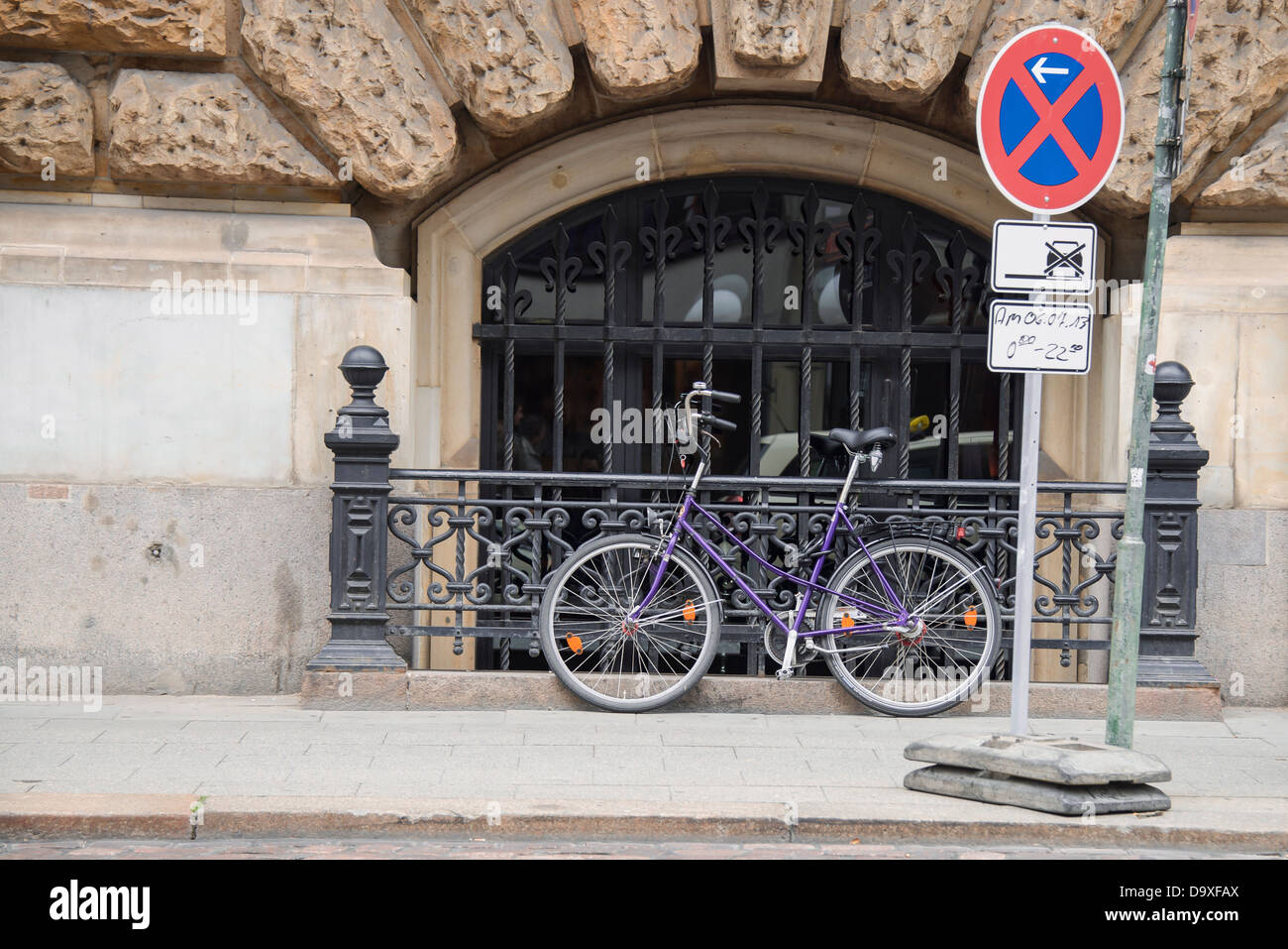 bike is secured on fence Stock Photo