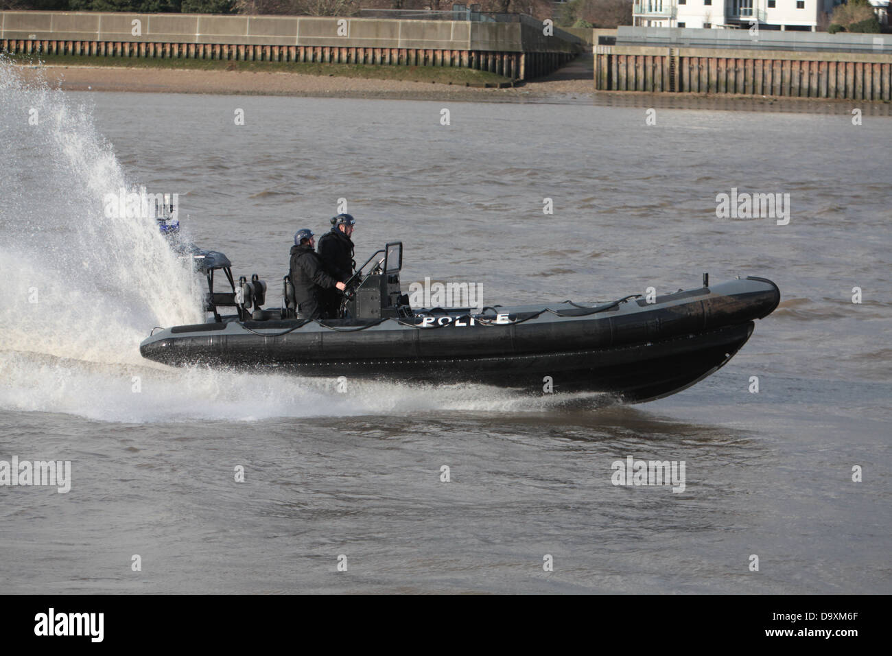 River Police speeding along the river Thames during exercise with Royal Marines. Stock Photo