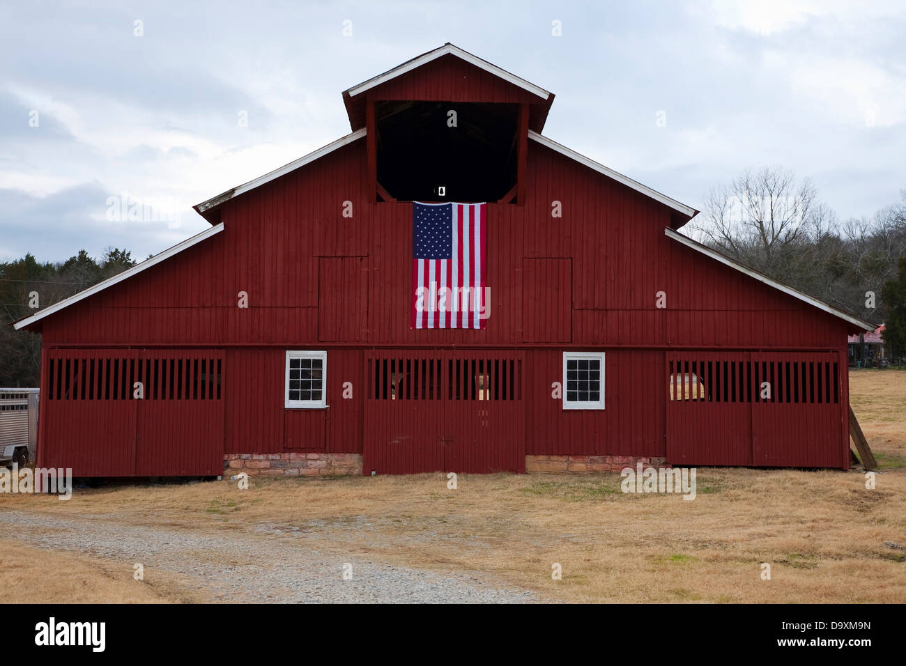 Red Barn And Us Flag Outside Of Franklin Tennessee A Suburb