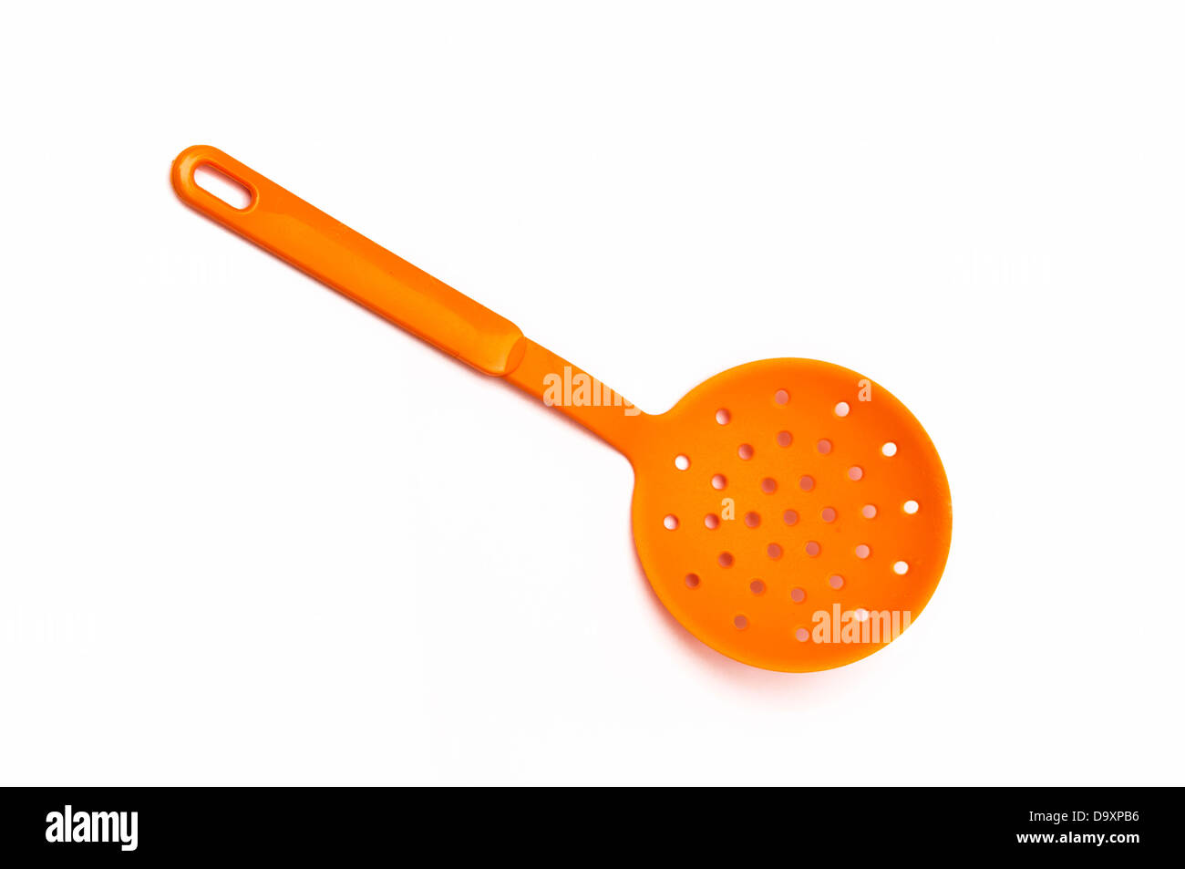 spatula yellow on a white background Stock Photo - Alamy