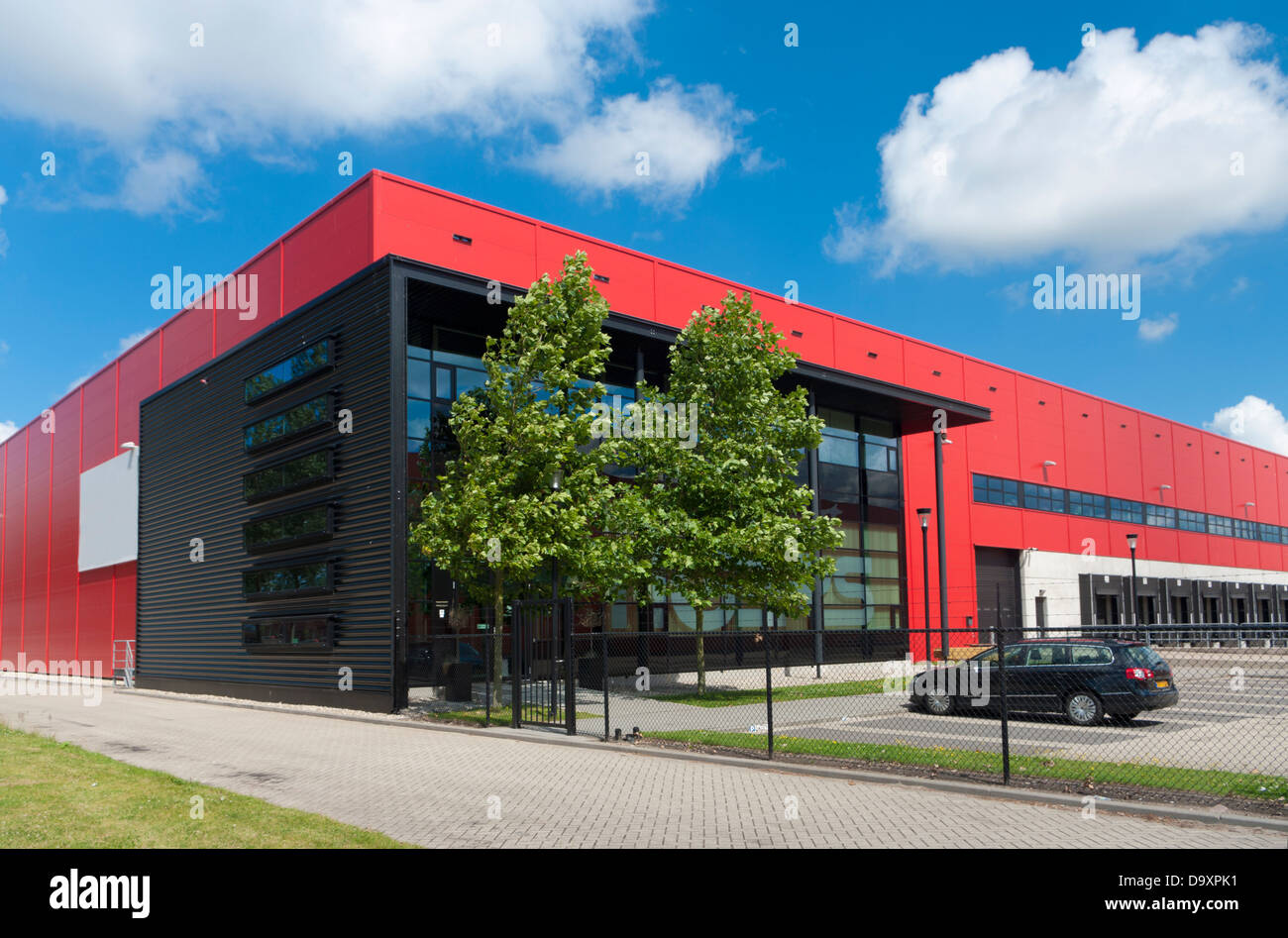 modern red warehouse in the Rotterdam harbor area Stock Photo - Alamy