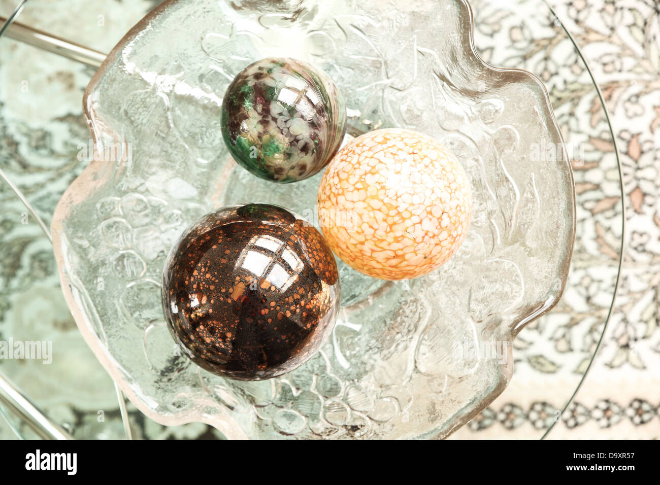 Some Decorative Christmas Spheres In A Glass Bowl Stock Photo
