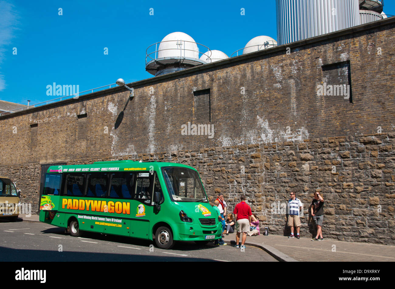 Paddywagon tourist sightseeing tour bus in front of Guinness Storehouse