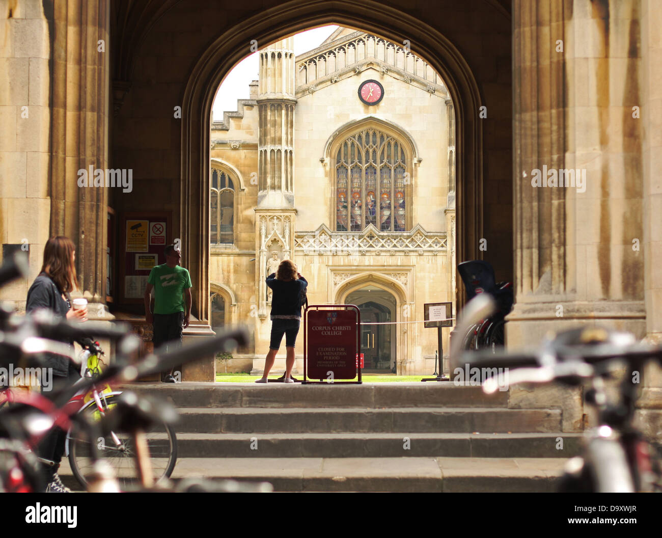 A tourist takes a photograph of Corpus Christi College in Cambridge. Stock Photo
