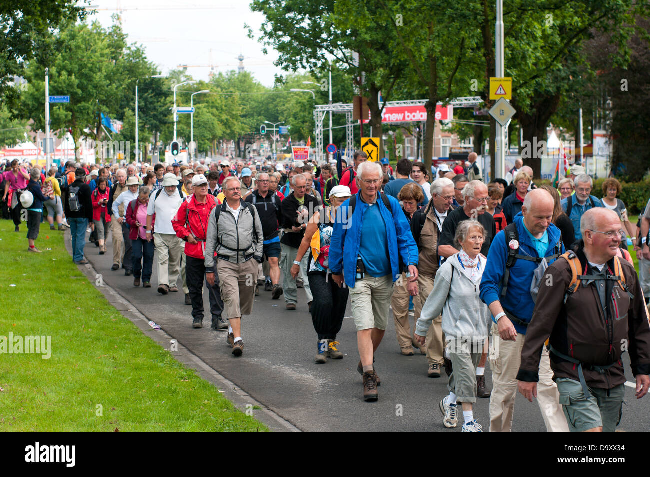 people marching in Nijmegen, Netherlands. It is the world's largest walking event with over 40,000 participants Stock Photo