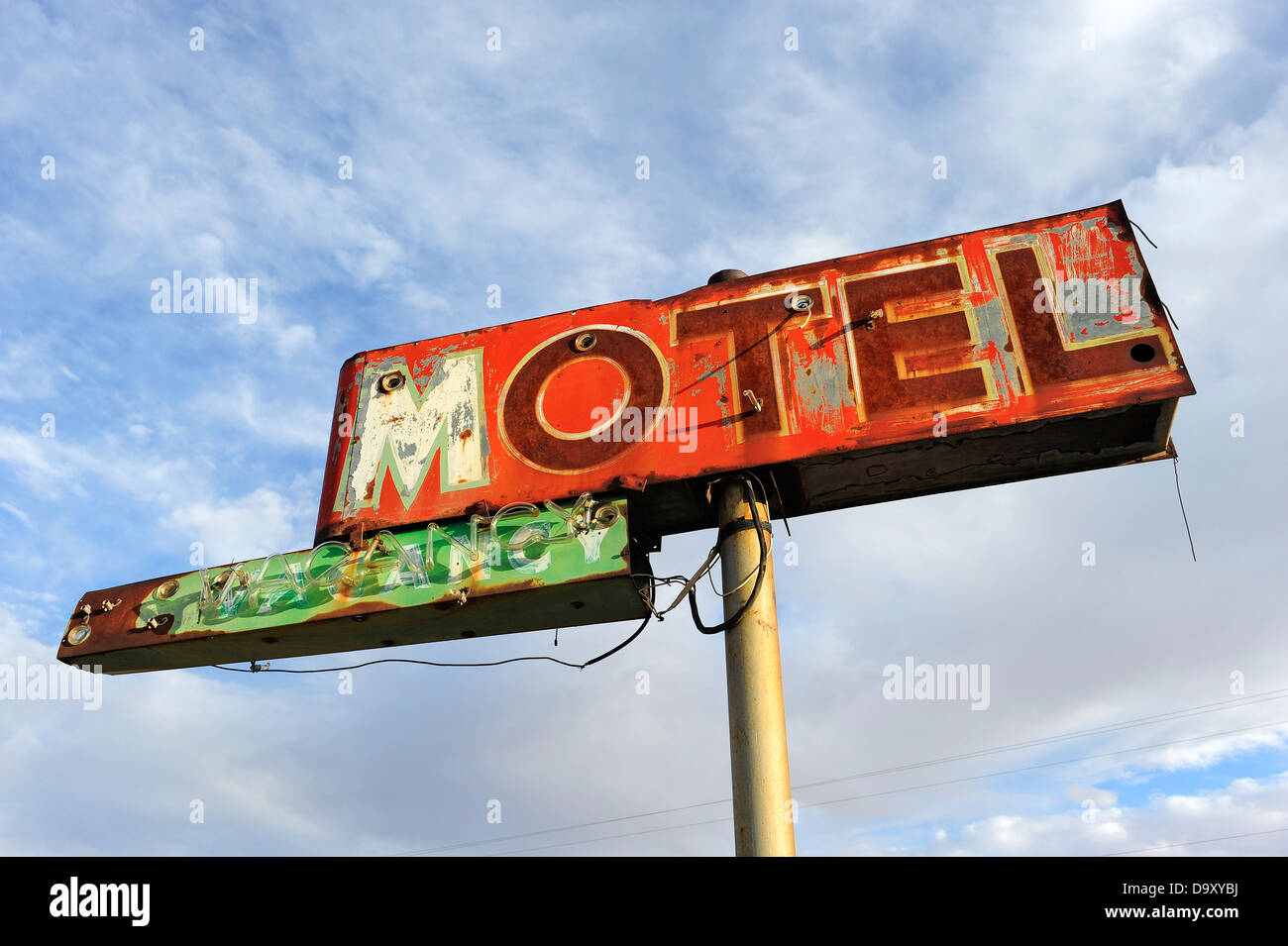 Rusted and broken Motel sign, against sky, Green River, Utah, USA. Stock Photo