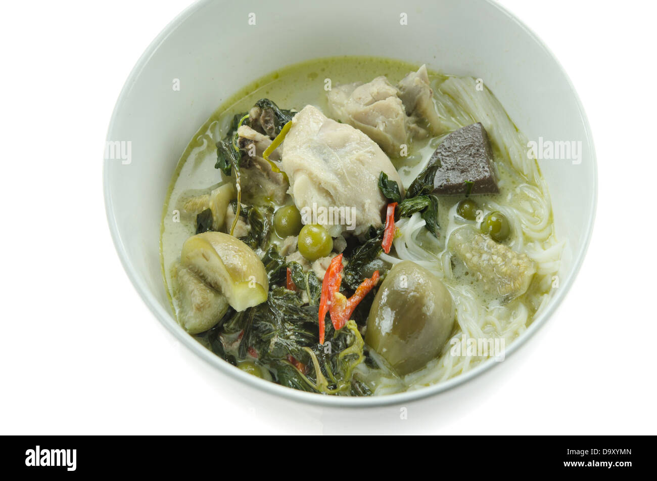 green chicken curry served with rice vermicelli in white bowl Stock Photo